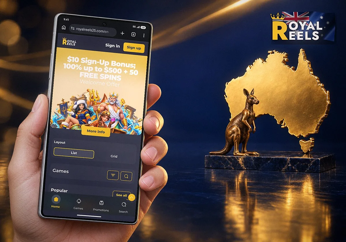 A hand holding a Samsung Galaxy with the Royal Reels home page open in Chrome, next to a gold map of Australia and a bronze kangaroo